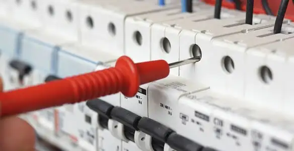 Electrical contractor testing circuit breakers during electrical repair in Lakeside, CA