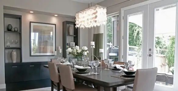 Elegant dining room chandelier installation above table in Escondido, CA