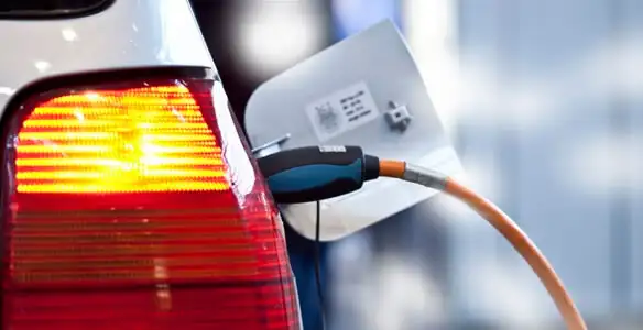 Electric car plugged into EV charger after professional installation in Escondido, CA