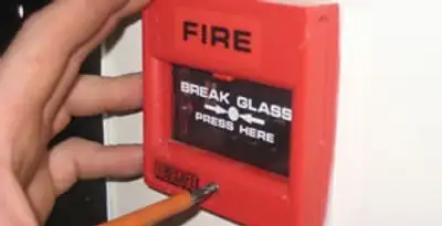 fire alarm installation service showing manual fire alarm pull station installed by licensed electricians in Escondido, CA