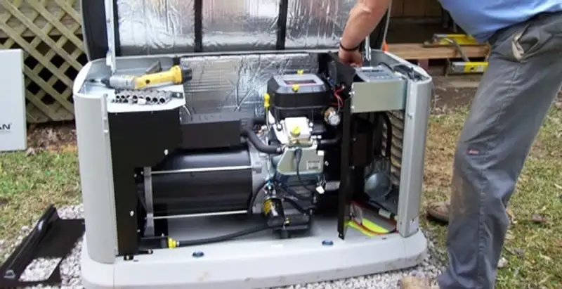 generator installation service showing technician connecting and configuring generator components in Escondido, CA