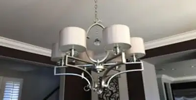 Modern chandelier installation with multiple light fixtures in Escondido, CA