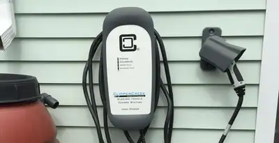 Outdoor electric vehicle charger installation on residential wall in Escondido, CA