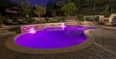 pool light installation and repair services illuminating a residential swimming pool in Escondido, CA