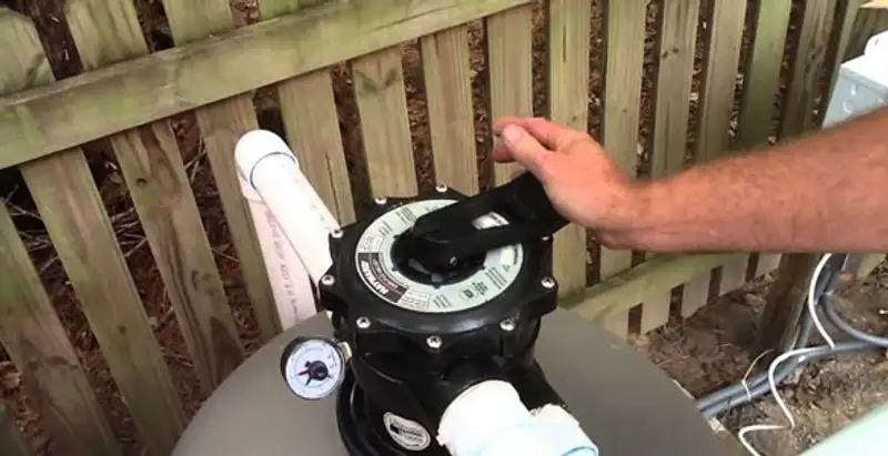 pool pumps service showing professional adjustment of pool pump control system in Escondido, CA
